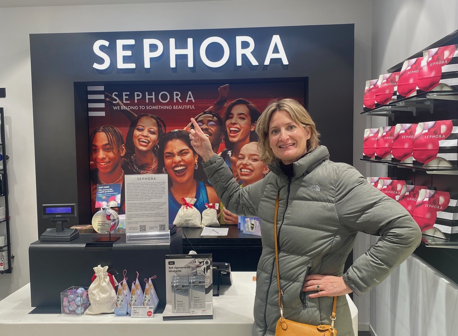 Total U Founder, Kim, reflects on finding her way in Sephora. In the image, she stands in front of a brand sign.