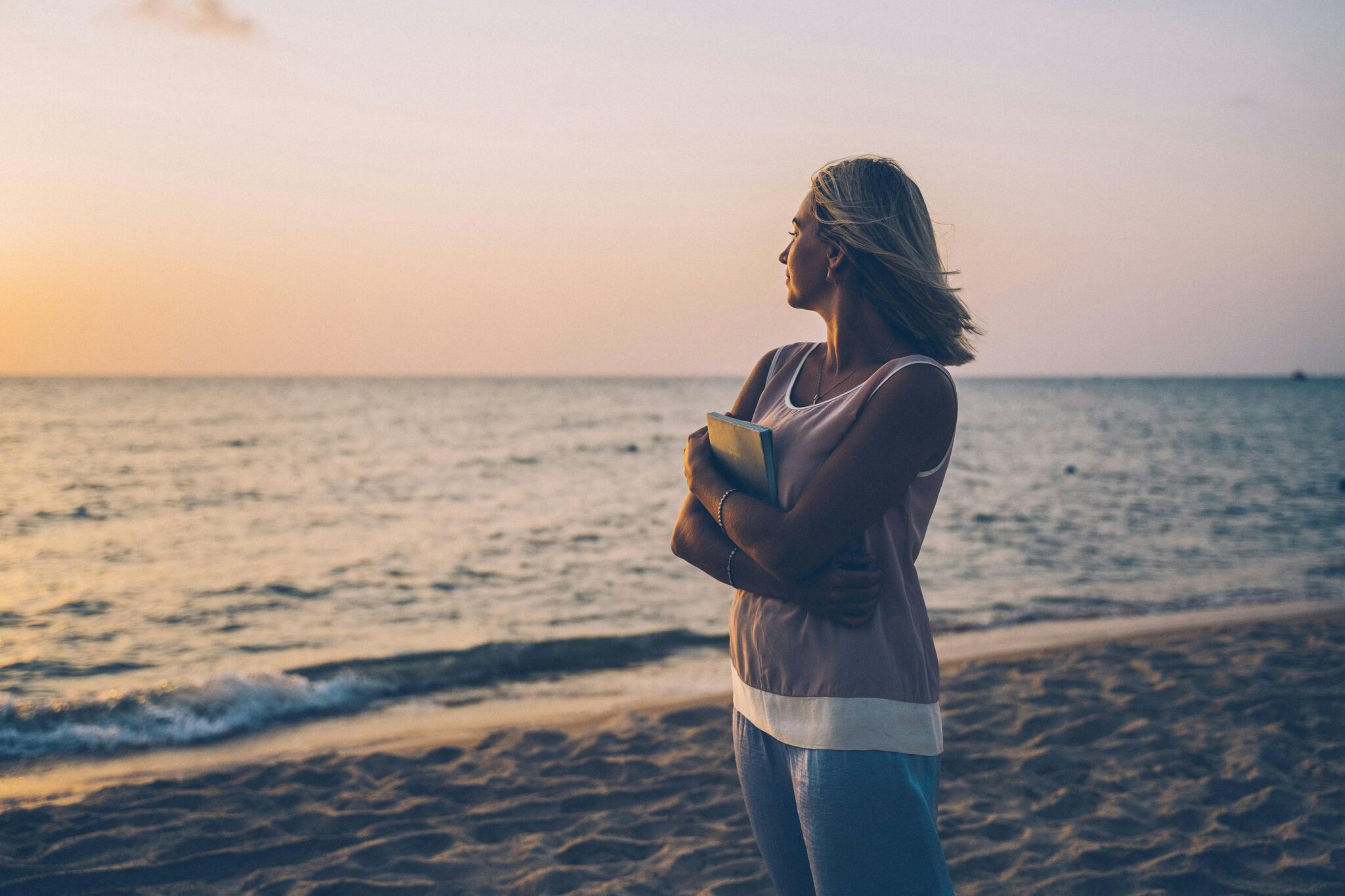 Woman looking away at the ocean wondering "Where Did "I" Go?"